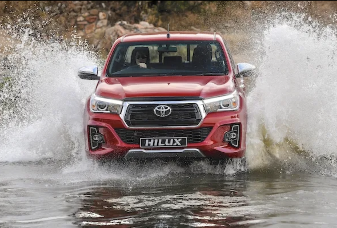 Toyota pickup driving through water